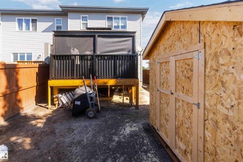 Raised deck with black railing and privacy screening - 91 Hilton Cove, Spruce Grove, AB - Outdoor With Exterior