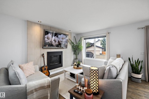 6716 Cardinal Road Sw, Edmonton, AB - Indoor Photo Showing Living Room With Fireplace