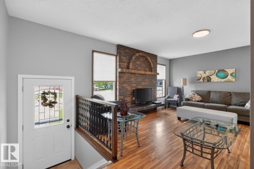 2408 80 Street Nw, Edmonton, AB - Indoor Photo Showing Living Room With Fireplace