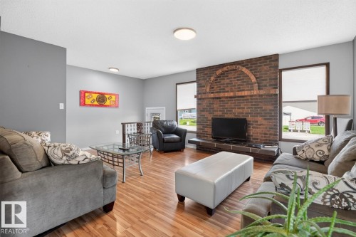 2408 80 Street Nw, Edmonton, AB - Indoor Photo Showing Living Room With Fireplace