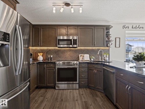 25 Wilkinson Place, Leduc, AB - Indoor Photo Showing Kitchen With Upgraded Kitchen
