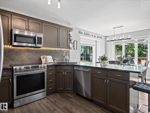 25 Wilkinson Place, Leduc, AB - Indoor Photo Showing Kitchen With Upgraded Kitchen