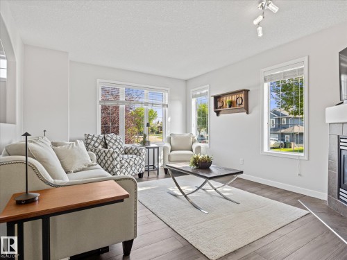 25 Wilkinson Place, Leduc, AB - Indoor Photo Showing Living Room With Fireplace