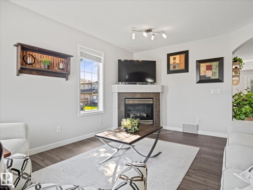 25 Wilkinson Place, Leduc, AB - Indoor Photo Showing Living Room With Fireplace
