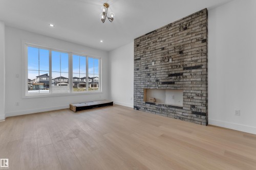 512 Robinson Boulevard, Leduc, AB - Indoor Photo Showing Living Room With Fireplace