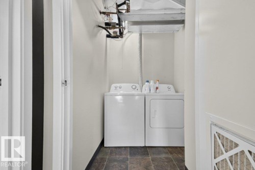Dedicated laundry area with tile flooring - #804 11027 87 Av Nw, Edmonton, AB - Indoor Photo Showing Laundry Room