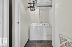 Dedicated laundry area with tile flooring - 