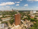 Brick high-rise building surrounded by urban landscaping, featuring multiple balconies and a large rooftop structure - #804 11027 87 Av Nw, Edmonton, AB  - Outdoor With View 