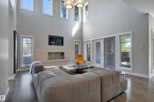5047 Mcluhan Road Nw, Edmonton, AB - Indoor Photo Showing Living Room With Fireplace