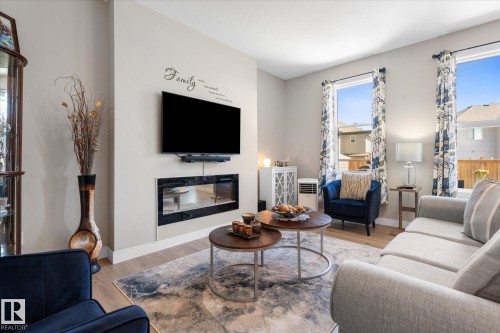 54 Astoria Place, Devon, AB - Indoor Photo Showing Living Room With Fireplace