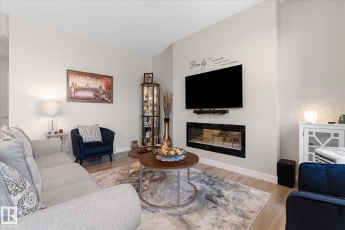 54 Astoria Place, Devon, AB - Indoor Photo Showing Living Room With Fireplace