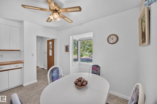 White cabinetry with wood-finish countertops - 5207 48 Avenue, Leduc, AB - Indoor Photo Showing Dining Room