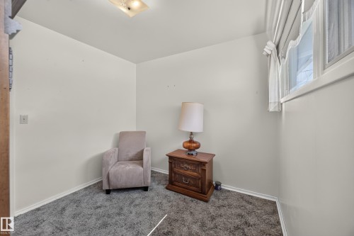 Recessed ceiling light fixture, neutral wall finishes, and gray carpeting - 5207 48 Avenue, Leduc, AB - Indoor