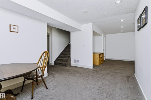 Recessed lighting, white walls, and gray carpeting - 1720 Robertson Place Sw, Edmonton, AB - Indoor