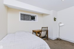 Recessed lighting and a window with white trim - 