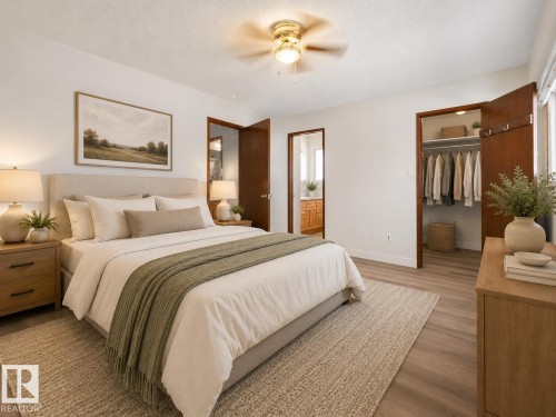 White walls complement wood-finish flooring - 7357 18 Avenue Nw, Edmonton, AB - Indoor Photo Showing Bedroom
