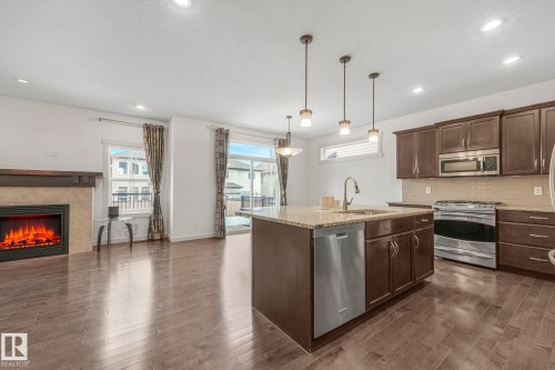 1548 36 Avenue Nw, Edmonton, AB - Indoor Photo Showing Kitchen With Fireplace With Stainless Steel Kitchen With Upgraded Kitchen