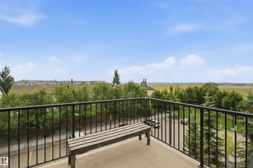 Balcony with black metal railing - #2415 9357 Simpson Dr Nw, Edmonton, AB - Outdoor With Balcony With View