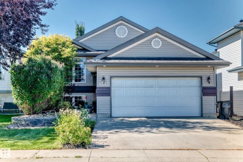 Two-story residential building with light gray siding and a gray shingled roof - 4210 37 Avenue Nw, Edmonton, AB - Outdoor
