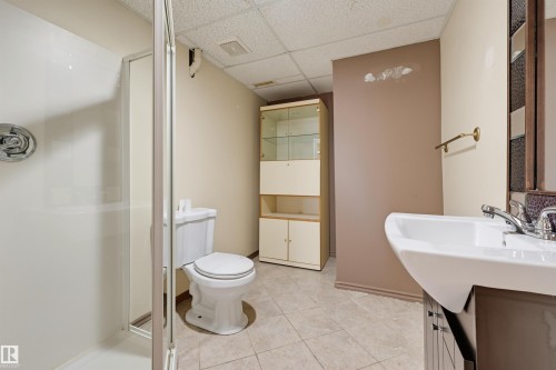 White ceramic tile flooring - 6768 39 Avenue Nw, Edmonton, AB - Indoor Photo Showing Bathroom