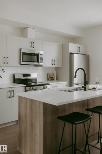 2635 Alces Way Sw, Edmonton, AB - Indoor Photo Showing Kitchen With Double Sink With Upgraded Kitchen