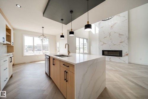 5 Pierwyck Loop, Spruce Grove, AB - Indoor Photo Showing Kitchen With Fireplace With Double Sink
