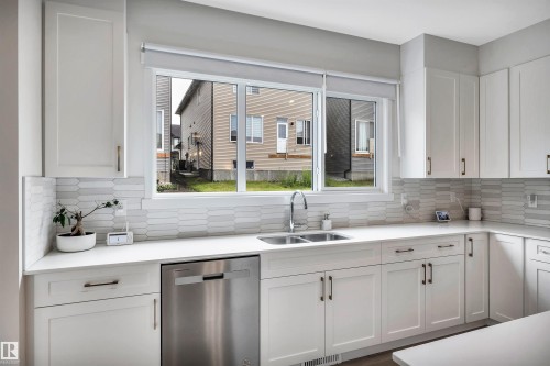 4930 Kinney Road Sw, Edmonton, AB - Indoor Photo Showing Kitchen With Double Sink