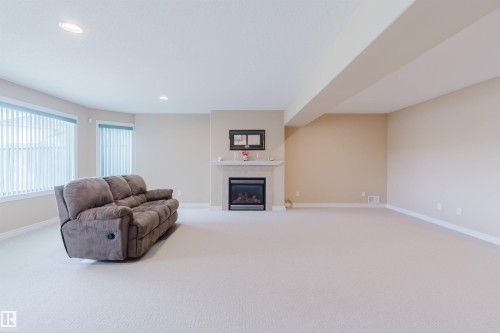 6604 Sandin Cove Nw, Edmonton, AB - Indoor Photo Showing Living Room With Fireplace
