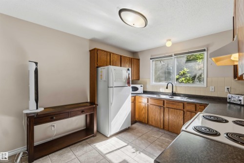 4210 49 Street, Gibbons, AB - Indoor Photo Showing Kitchen With Double Sink