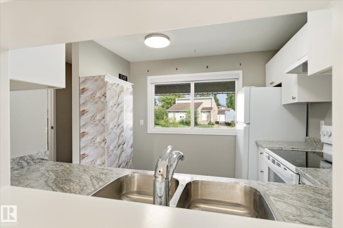 #2 13833 30 St Nw, Edmonton, AB - Indoor Photo Showing Kitchen With Double Sink