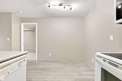 Neutral-toned walls complement wood-finish flooring - 