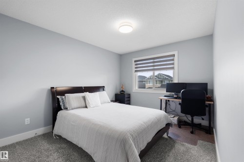 Light gray wall color, textured ceiling, flush mount ceiling light, white window trim, grey window blinds - 16327 17 Avenue Sw, Edmonton, AB 
