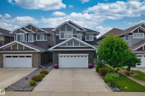 Contemporary exterior with stone veneer and siding accents - 16327 17 Avenue Sw, Edmonton, AB 