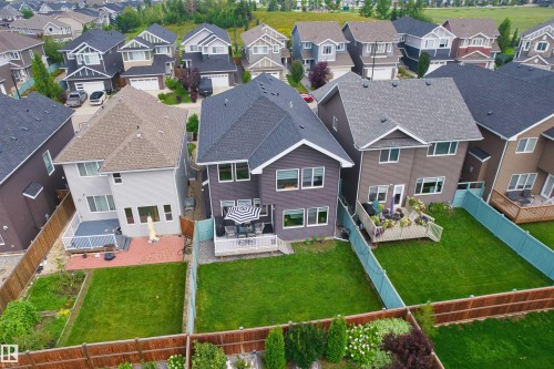 Manicured lawns, mature landscaping, and private fencing - 16327 17 Avenue Sw, Edmonton, AB 