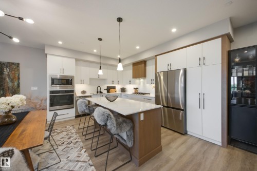 #312 7471 May Cm Nw, Edmonton, AB - Indoor Photo Showing Kitchen With Stainless Steel Kitchen With Upgraded Kitchen