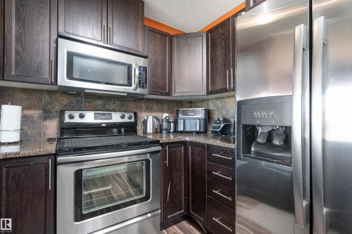 #146 5420 Grant Macewan Bv, Leduc, AB - Indoor Photo Showing Kitchen With Stainless Steel Kitchen