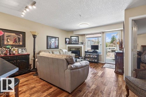 #112 6703 172 St Nw, Edmonton, AB - Indoor Photo Showing Living Room With Fireplace