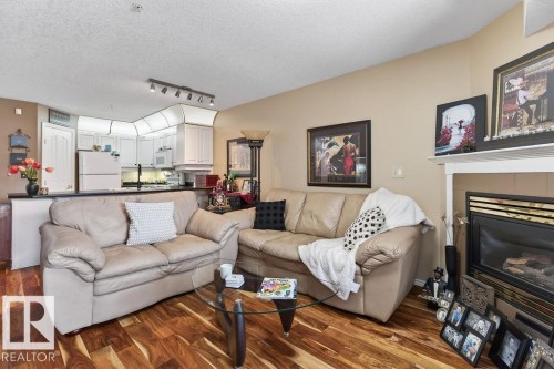 #112 6703 172 St Nw, Edmonton, AB - Indoor Photo Showing Living Room With Fireplace