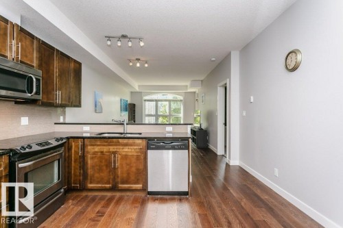 #209 10811 72 Av Nw, Edmonton, AB - Indoor Photo Showing Kitchen With Stainless Steel Kitchen