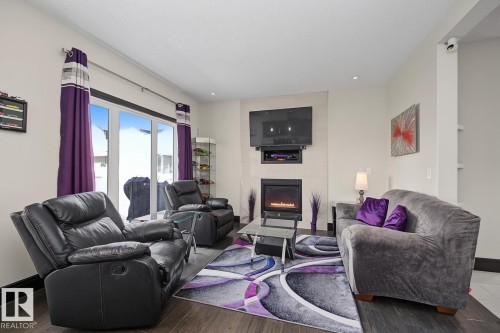 3629 Hummingbird Way Nw, Edmonton, AB - Indoor Photo Showing Living Room With Fireplace