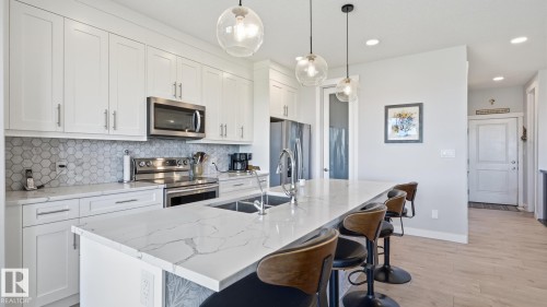 142 Aston Bend, Leduc, AB - Indoor Photo Showing Kitchen With Double Sink With Upgraded Kitchen