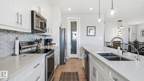 142 Aston Bend, Leduc, AB - Indoor Photo Showing Kitchen With Double Sink With Upgraded Kitchen