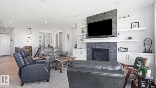 142 Aston Bend, Leduc, AB - Indoor Photo Showing Living Room With Fireplace