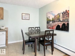 Tiled flooring, light-toned walls, and wood-finish cabinetry - 