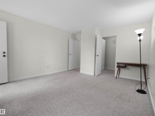 Carpeted flooring, white walls, and white trim - #47 1904 48 St Nw, Edmonton, AB - Indoor Photo Showing Other Room