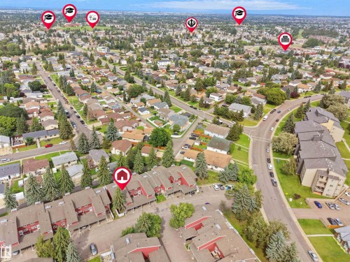 Aerial perspective showcasing a residential neighborhood with detached homes, apartment buildings, and townhomes - #47 1904 48 St Nw, Edmonton, AB - Outdoor With View
