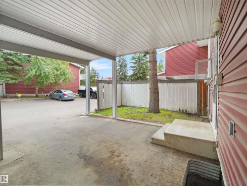 Covered carport with concrete flooring, providing sheltered parking - #47 1904 48 St Nw, Edmonton, AB - Outdoor With Exterior