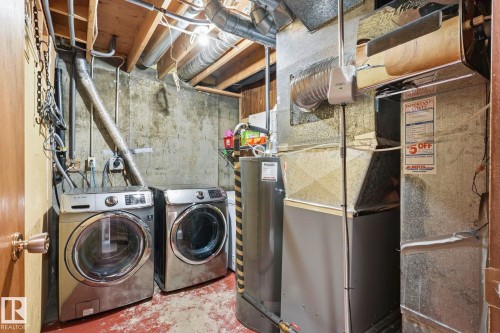 Utility space featuring exposed ductwork, a water heater, and a furnace system - 10007 168 Avenue Nw, Edmonton, AB - Indoor Photo Showing Laundry Room