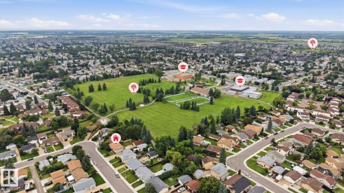 Expansive residential area with numerous detached properties, winding streets, and a large central green space - 10007 168 Avenue Nw, Edmonton, AB - Outdoor With View