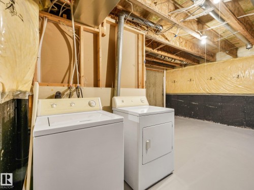 Washer and dryer - 1142 Barnes Way Sw, Edmonton, AB - Indoor Photo Showing Laundry Room